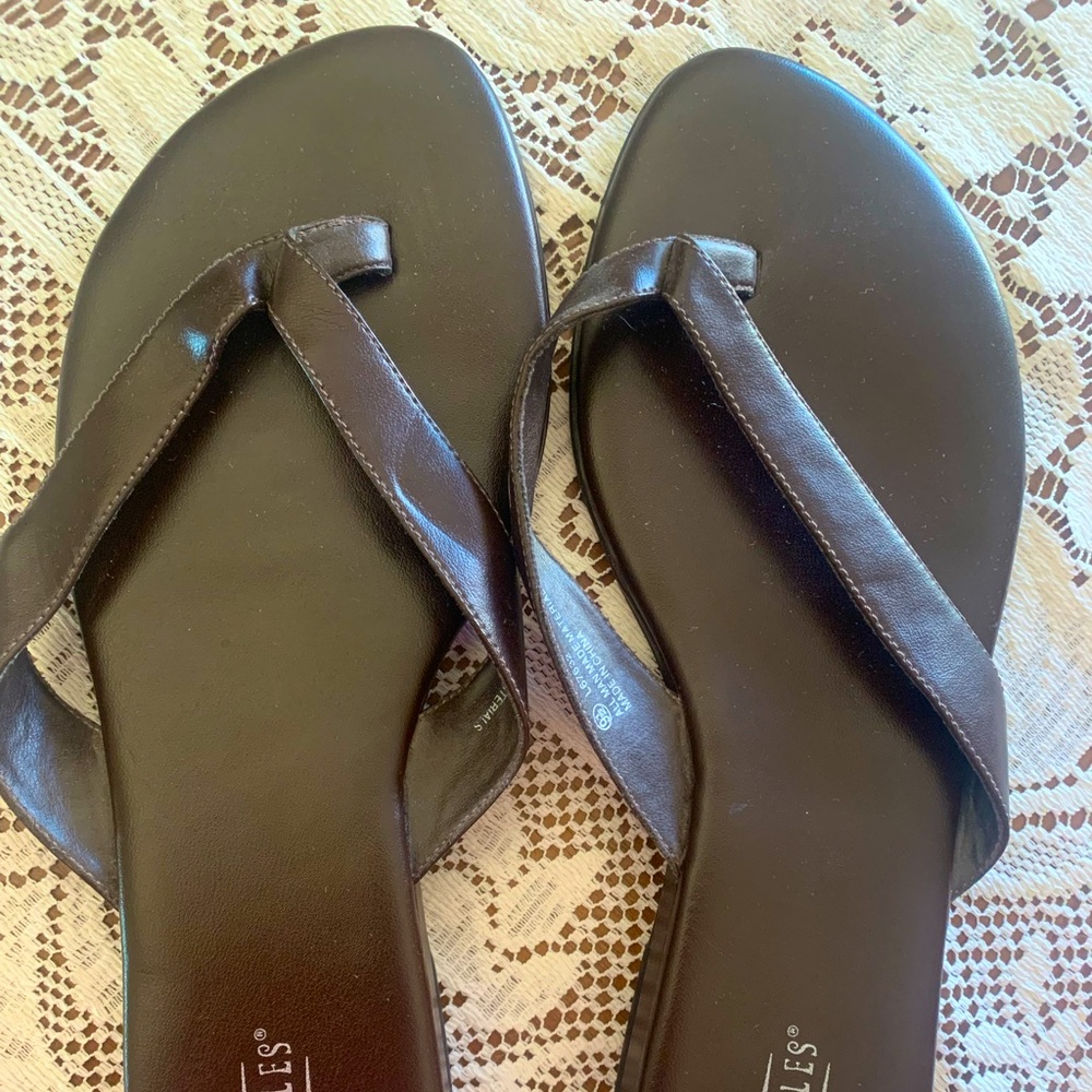 Dark brown flip-flops.
